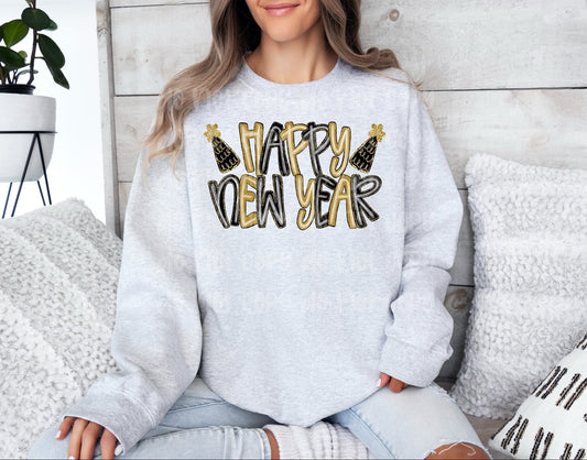 Person wearing a gray sweatshirt with 'Happy New Year' text, sitting on a couch.